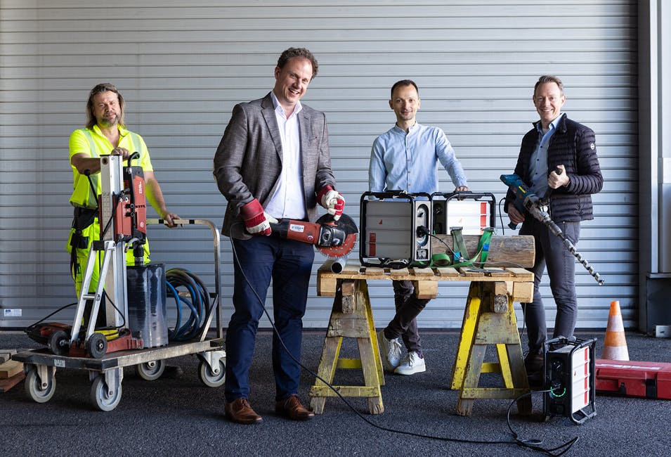 Men smiling while powering tools by Instagrid ONE Max