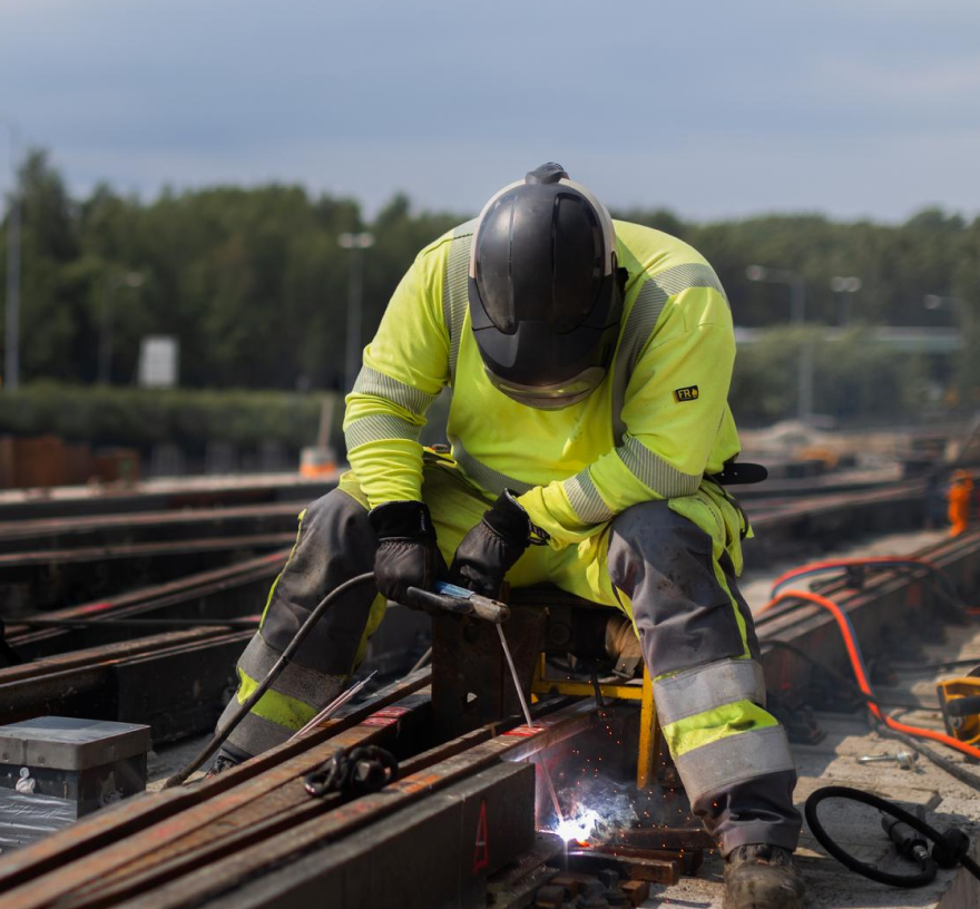 Man using instagrid ONE Max for welding railroad