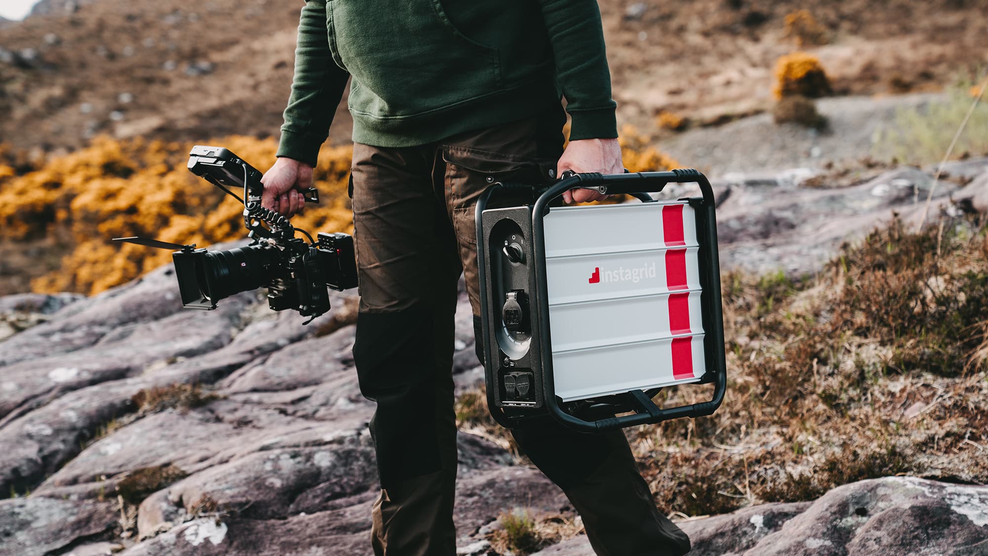 instagrid ONE max and a camera carried in rural area, Convary