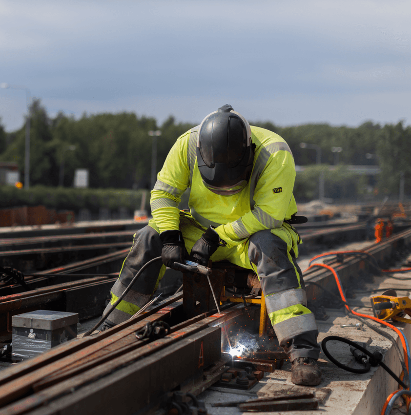 Worker welding a railway