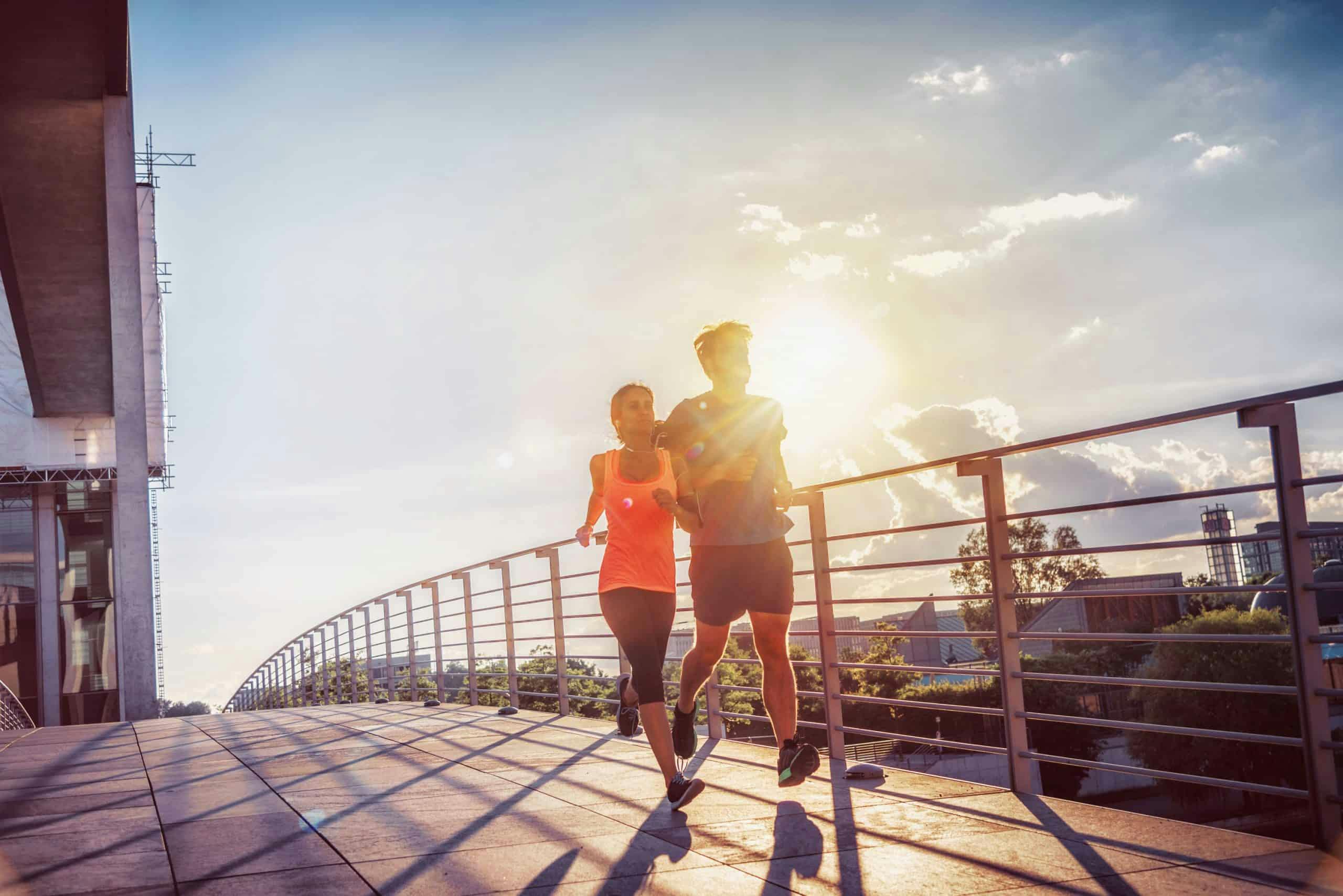 Man and woman jogging outside