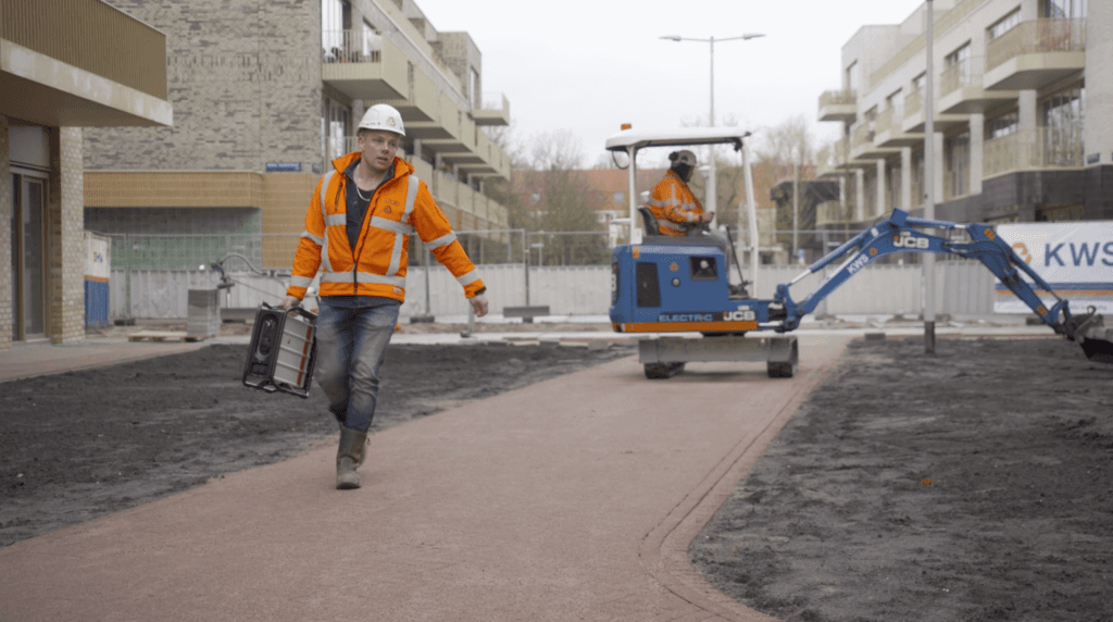 Construction Worker carrying instagrid with one hand